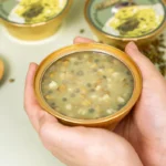 Refreshing Herbal Dessert with Pandan Mung Bean and Coconut Creaminess in Every Spoon Experience the natural comfort of Southeast Asian tradition in a modern format. Our Pandan Mung Bean and Lotus Seed Dessert Drink is a smooth plant-based treat made with real ingredients and no artificial additives. Blending the earthy taste of mung beans with the creaminess of coconut milk and the floral aroma of pandan leaves this jelly-style dessert is crafted for those who want clean label sweetness without compromise. Whether served chilled on a warm day or enjoyed as an afternoon pick-me-up it offers gentle nourishment and satisfaction in every pouch. No refrigeration needed. No preservatives. Just naturally good flavor and texture that fits busy modern lives. Mung Bean Lotus Seed Jelly Key Features Functional Herbal Blend: Combines green mung beans and lotus seeds, traditionally known for clearing heat and supporting digestion. Naturally Cooling & Refreshing: Flavored with aromatic pandan (screw pine) for a floral, tropical finish. No Preservatives or Artificial Additives: Clean formula made for health-conscious consumers. Ready-to-Eat Convenience: No heating or refrigeration required. Enjoy anytime, anywhere. Export-Ready with OEM/ODM Options: Ideal for private label functional food brands. Mung Bean Lotus Seed Jelly Specification Details Product Name Pandan Mung Bean and Lotus Seed Dessert Drink Net Weight 168g Ingredients Water Mung Bean Sago Xylitol Coconut Milk Pandan Leaf Powder Texture Soft jelly with chewy sago and visible mung bean and lotus seed pieces Flavor Profile Lightly sweet with pandan aroma and coconut smoothness Storage Condition Store in a cool dry place below 25°C Shelf Life 12 months Format Ready to eat shelf stable retort pouch Certifications ISO22000 HACCP HALAL available Free From Preservatives added sugar artificial colors or flavors OEM and Private Label Available for global functional food partners Key Benefits: Supports healthy digestion and internal cooling Naturally low in sugar, sweetened with xylitol only Plant-based and dairy-free, using coconut milk for richness Ready to eat with no heating or prep required Free from preservatives, artificial flavors or added sugar Perfect for summer, post-meal refreshment, or wellness snack routines Mung Bean Lotus Seed Jelly Ideal Consumption Scenarios: Summer afternoon refreshment After a spicy meal to balance internal heat Late-night snack without sugar guilt Gift boxes for holidays or seasonal wellness bundles Shelf-ready healthy dessert lines for supermarkets or eCommerce platforms Let’s Create Your Own Formula Our experienced R&D and manufacturing teams can tailor formulations to meet your target market's taste and wellness trends. We support low MOQ customization, multi-language labeling, and fast turnaround times for global clients. This product is shelf-stable and comes in a 168g portion pouch — ideal for retail, gifting, or daily nourishment. OEM and private label services are available for global functional food brands. Mung Bean Lotus Seed Jelly